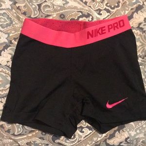 Nike pros with pink band